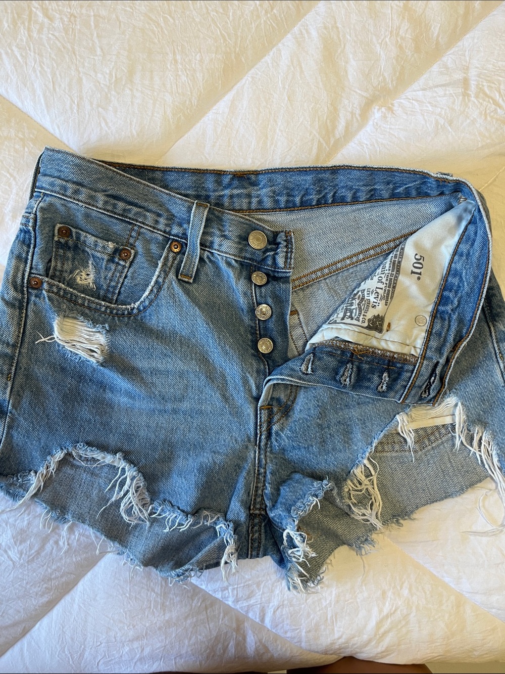 Levy’s Vintage-Inspired Light Blue Distressed Denim Shorts